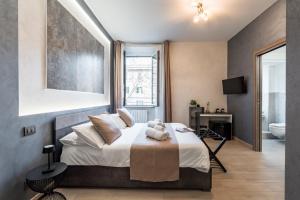 Postel nebo postele na pokoji v ubytování Domus Æterna - Re di Roma