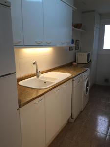 Kuchyň nebo kuchyňský kout v ubytování Apartamento Rosendo