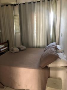 Pousada Simples José客房内的一张或多张床位