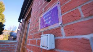 a sign on the side of a brick building at Villa Farm York in York