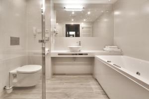 Koupelna v ubytování Prezident Luxury Spa & Wellness Hotel