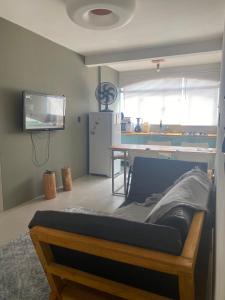 Μια τηλεόραση ή/και κέντρο ψυχαγωγίας στο Apartamento Studio 203
