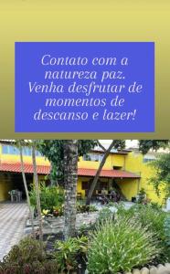 a sign for a natalatal pass in front of a building at Via sol rio das ostras in Rio das Ostras +2 photos