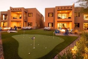 an apartment building with a golf course in the yard at Villas 2, 3 The Villas At Troon North in Scottsdale