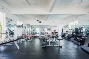 a gym with treadmills and machines in a room at Cindy's Ample home in Mombasa