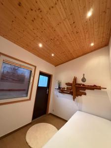 a room with a bed and a window and a door at Sweet dreams in Blankenfelde