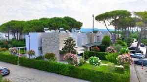 a house with a garden in front of it at Lura 3 Holiday Homes 178 in Lalzit Bay