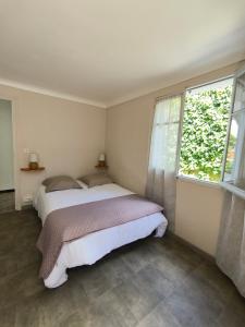 Postel nebo postele na pokoji v ubytování Appartement 4 pers, 2 chambres, en RDC d'une maison, à Luz Saint Sauveur, Hautes-Pyrénées