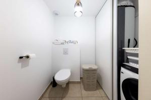 a small bathroom with a toilet and a sink at Appartement 3 pièces 4 couchages Saint Pierre d'Oléron SPO000-694 in Saint-Pierre-dʼOléron