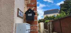 a clock on the side of a building at Romantic ideal young couple Portable aircon in Collioure