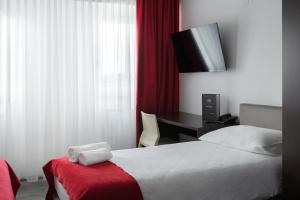 Postel nebo postele na pokoji v ubytování Hotel Prunk