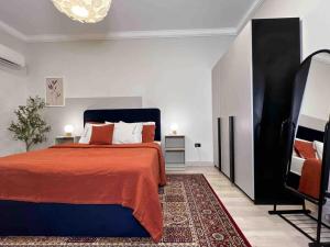 a bedroom with a bed and a television in it at 6th Of October Signature Stay in 6th Of October