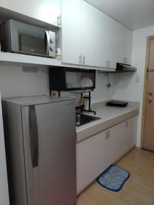 Η κουζίνα ή μικρή κουζίνα στο Mplace residence condominium