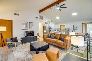 a living room with a couch and a table at Premier Trout Fishing Scenic White River Cabin in Lakeview