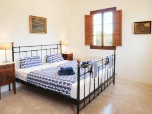 a bedroom with a bed and a window at Finca la Querida in Campos +47 photos
