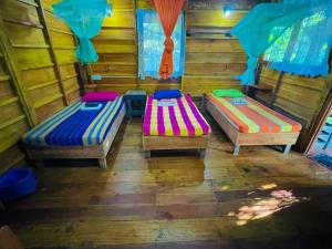 Postel nebo postele na pokoji v ubytování Sigiriya Rastha Hostel