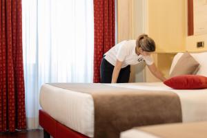 Posteľ alebo postele v izbe v ubytovaní Al Viminale Hill Inn & Hotel