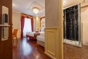 Posteľ alebo postele v izbe v ubytovaní Al Viminale Hill Inn & Hotel