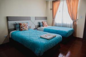 Postel nebo postele na pokoji v ubytování Hotel Casa Kolping Quito