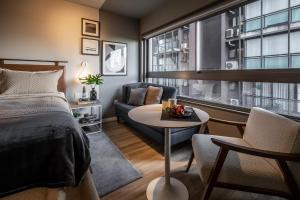 Cama ou camas em um quarto em Noon Vila Madalena