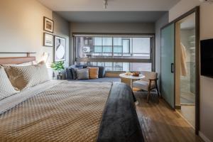 Cama ou camas em um quarto em Noon Vila Madalena mais 37 fotos