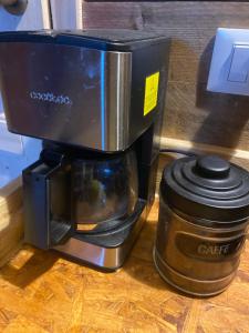 a coffee maker sitting on top of a table at Ok Corral ranch bed and breakfast western in Misano Adriatico