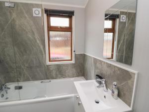 a bathroom with a sink and a mirror at Lakeside 18 in Carnforth +41 photos