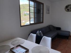 a living room with a couch and a table at Castaño II in Valle Gran Rey