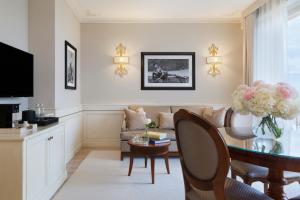 a living room with a couch and a table at Grand Hotel Imperiale in Forte dei Marmi