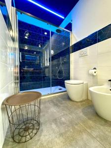 a bathroom with a shower and a toilet and a sink at La Terrazza in Cantarana