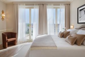 Postel nebo postele na pokoji v ubytování Grand Hotel Imperiale
