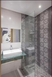 a bathroom with a sink and a bath tub at Urban Chic 2 bedrooms in Utimate City Center in Marrakech +26 photos