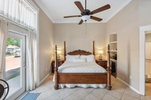 a bedroom with a bed and a ceiling fan at The Justin Room at The Eastland Historic Hotel in Eastland +13 photos
