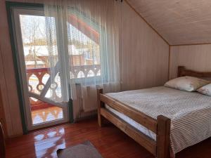 Postel nebo postele na pokoji v ubytování Садиба Кичера