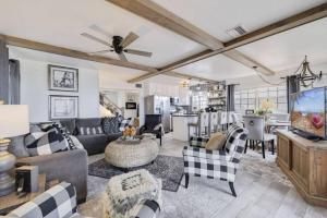 a living room with a couch and a table at Casa Del Sol - Private Beachfront, Pool Table in Clearwater Beach
