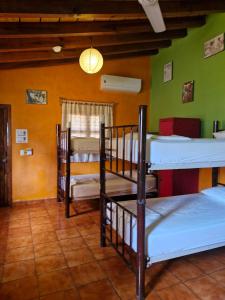 Postel nebo postele na pokoji v ubytování Casa Kraken Hostel