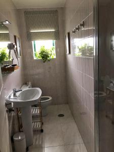 a bathroom with a sink and a toilet and a shower at Dulce Mañana in Portomarin +46 photos
