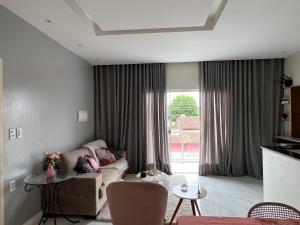 พื้นที่นั่งเล่นของ Quarto com banheiro privado 15km de Belém