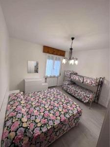 Postel nebo postele na pokoji v ubytování Appartamento Rimini Vacanza