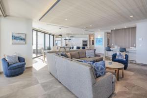 a living room with a couch and two chairs at LUXURY NEW OCEANFRONT CONDO 5BR Sleeps 12 in Puerto Peñasco
