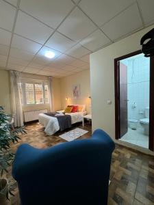 Postel nebo postele na pokoji v ubytování Hostal Real
