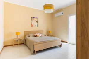 Ένα ή περισσότερα κρεβάτια σε δωμάτιο στο Villa Vintage 8 posti "Emozioni del passato"