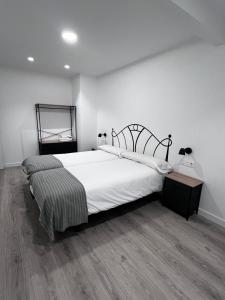 Postel nebo postele na pokoji v ubytování Hostal Mónaco