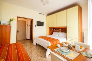 A bed or beds in a room at Residence Sabrina