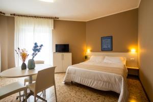A bed or beds in a room at Residence Sabrina