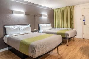 a hotel room with two beds and a window at Studio 6-Fort Worth, TX - West Medical Center in White Settlement +17 photos