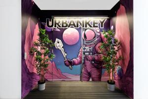 a painting of an astronaut holding a key in a doorway at UrbanKey Pods - Vienna Neubau in Vienna +5 photos