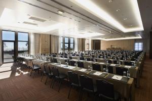 a large room with rows of tables and chairs at Real Marina Hotel & Spa in Olhão +37 photos