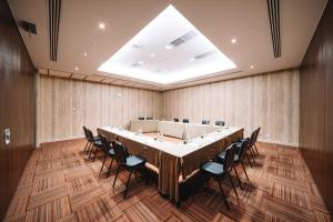 a large conference room with a long table and chairs at Real Marina Hotel & Spa in Olhão