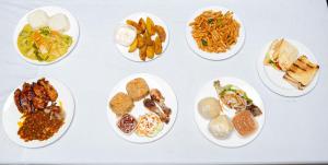 a bunch of plates of food on a table at Boko Boko Guesthouse in Busua